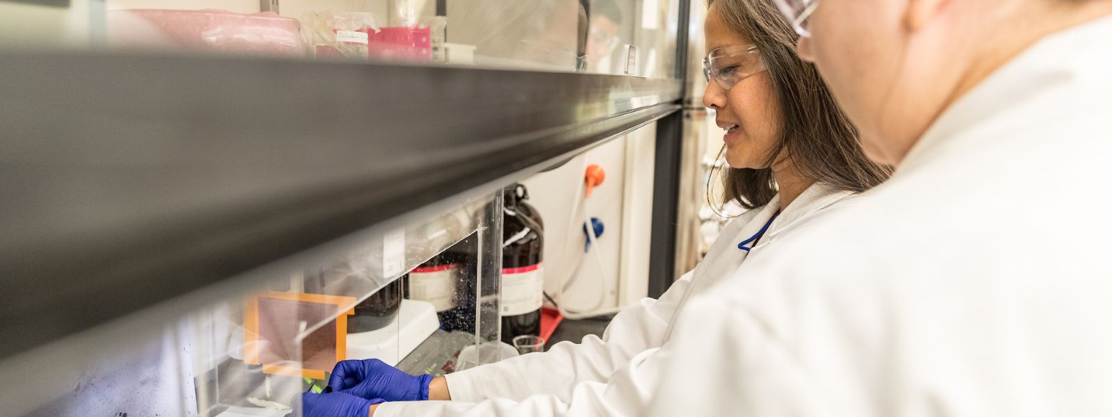 Faculty and student in research lab.