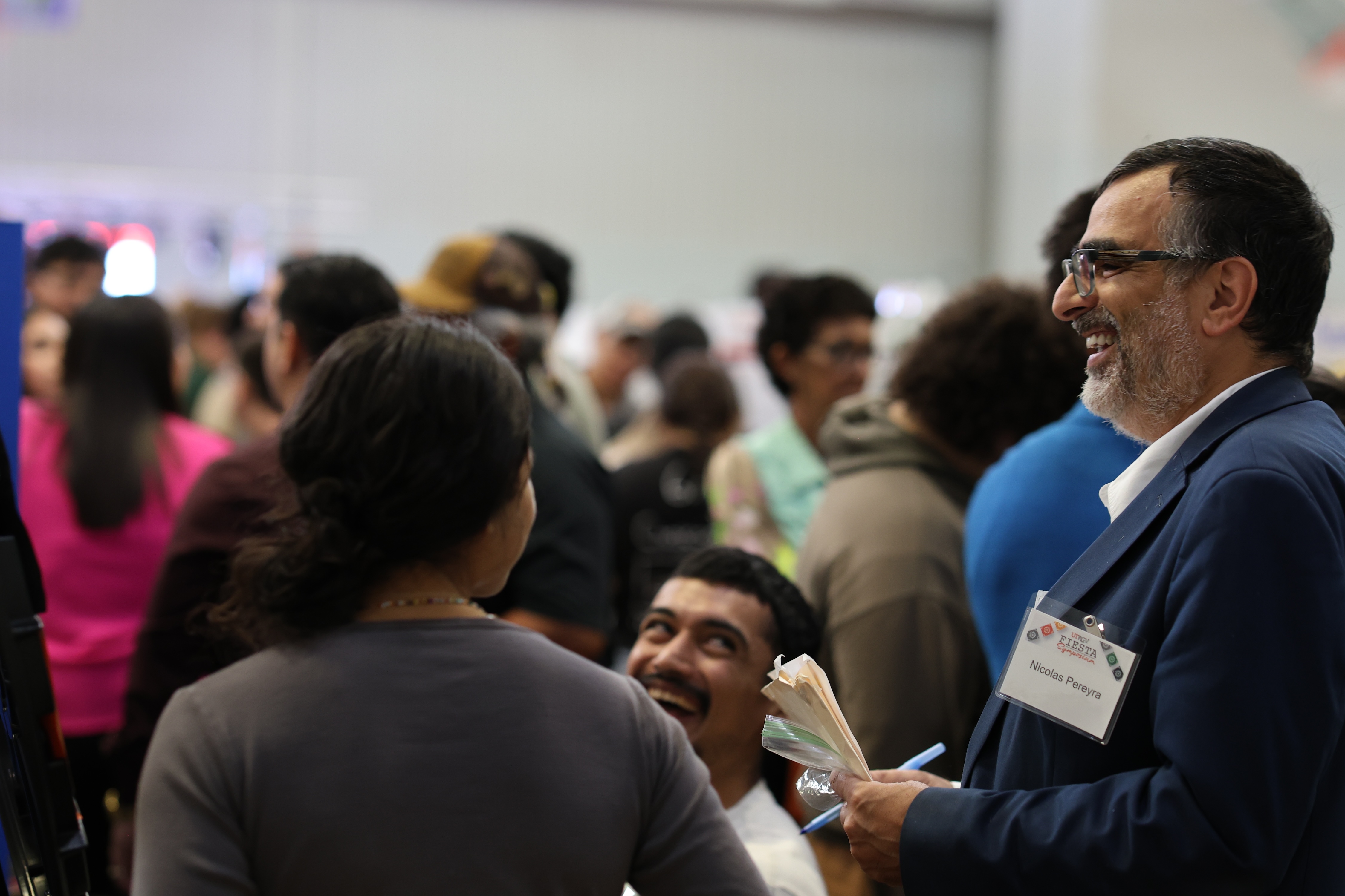 Dr. Nicolás Pereyra, co-principal investigator and professor of astronomy and physics at UTRGV, speaks with students during the FIESTA Symposium.